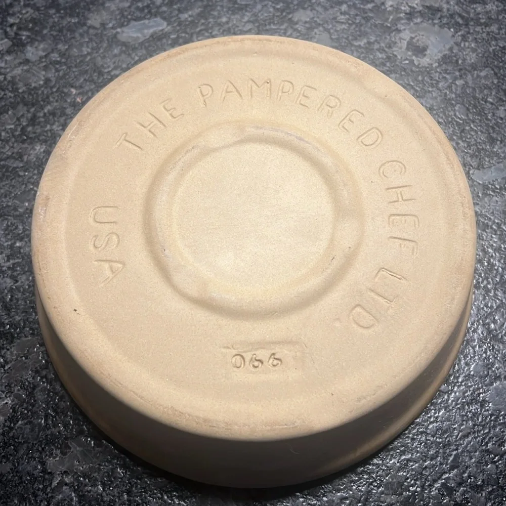 8” stone baker by Pampered Chef. Stone is partially seasoned since used.
